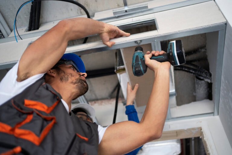 low-angle-people-working-with-drill